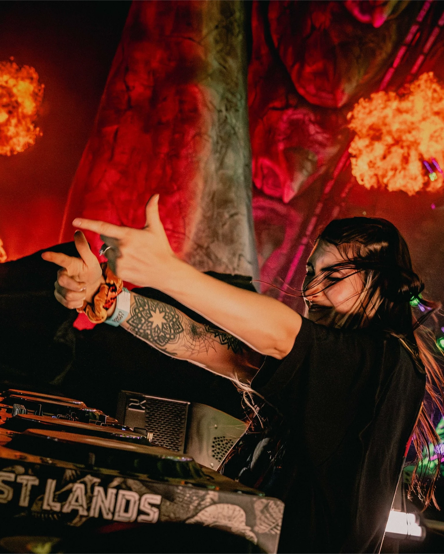 Level Up kicking toward the camera on a waterfront festival deck at night